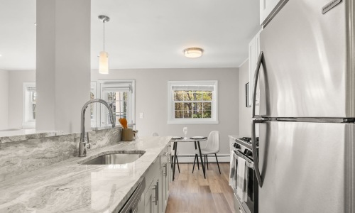 Renovated kitchen with quartz countertops at Sussex Square Apartments in Plymouth Meeting PA