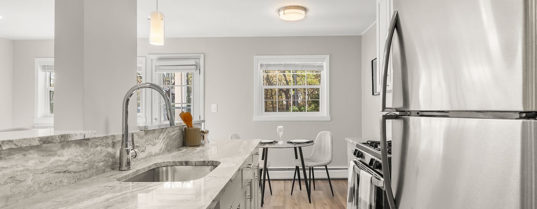 Renovated kitchen with quartz countertops at Sussex Square Apartments in Plymouth Meeting PA