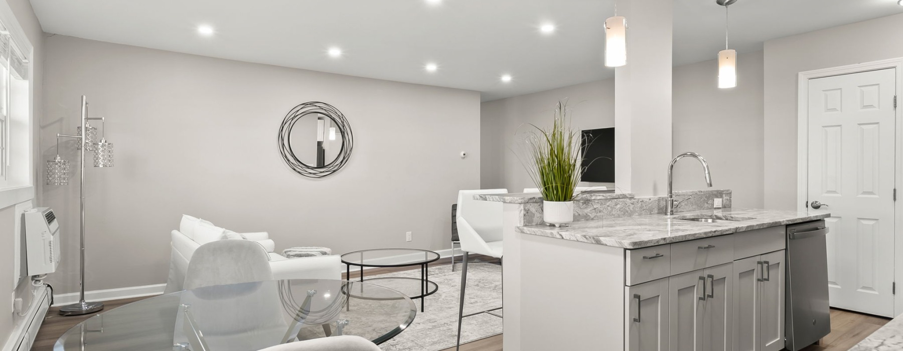 Renovated kitchen with quartz countertops at Sussex Square Apartments in Plymouth Meeting PA