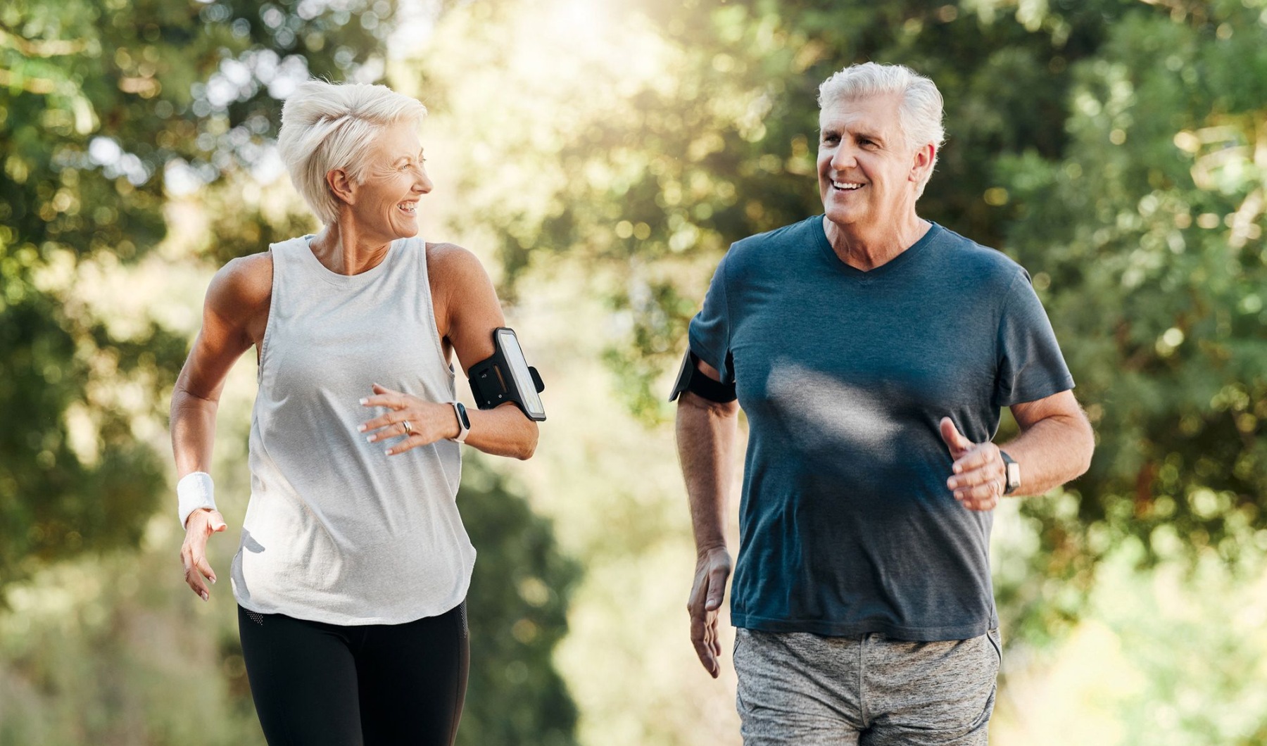 a man and a woman jogging outdoors